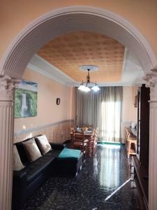 a living room with a couch and a table at APARTAMENTOS La PEÑA D in La Guancha
