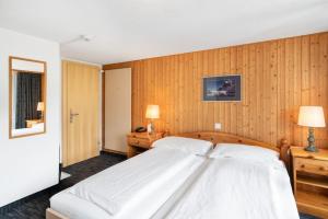 Letto o letti in una camera di Jungfrau Lodge, Swiss Mountain Hotel