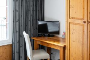 TV o dispositivi per l'intrattenimento presso Jungfrau Lodge, Swiss Mountain Hotel