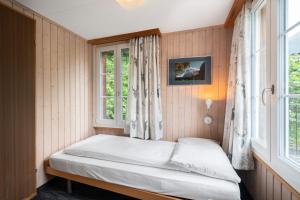 Letto o letti in una camera di Jungfrau Lodge, Swiss Mountain Hotel