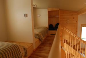 מיטה או מיטות בחדר ב-Les Chalets du Bioparc