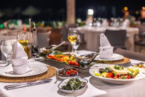 a table with plates of food on top of it at Hotel Ekincik in Ekincik