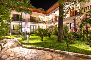 an exterior view of a hotel at night at Hotel Ekincik in Ekincik
