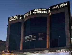 a building with a sign for a hotel at Hotel Islamabad Premiere Inn in Islamabad