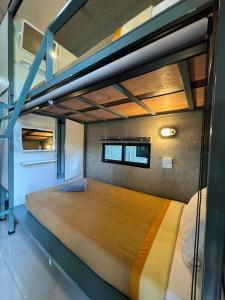 a bed in a room with a bunk bed at Atlas Central in Pai +26 photos