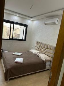 Ένα ή περισσότερα κρεβάτια σε δωμάτιο στο Appartement neuf