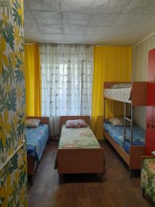 Postel nebo postele na pokoji v ubytování Eva Hostel