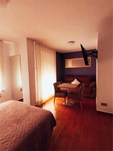 Postel nebo postele na pokoji v ubytování Hotel Herreros