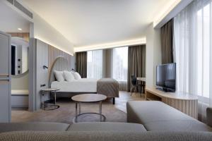 Uma televisão e/ou sistema de entretenimento em Nordic Hotel Forum