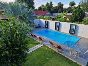 an image of a swimming pool in a backyard at Atlas Central in Pai