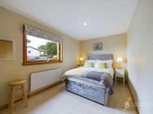 Katil atau katil-katil dalam bilik di Solberg - Charming two bedroom cottage in Lerwick