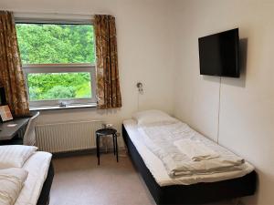 TV a/nebo společenská místnost v ubytování Aarhus Hostel og Hotel