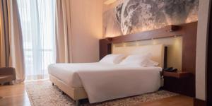 Voodi või voodid majutusasutuse Risorgimento Resort toas