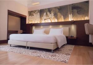 Voodi või voodid majutusasutuse Risorgimento Resort toas