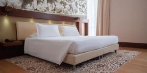 Voodi või voodid majutusasutuse Risorgimento Resort toas
