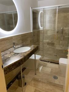 a bathroom with a sink and a shower and a toilet at Cozy Luxury Room Pantheon in Rome +67 photos