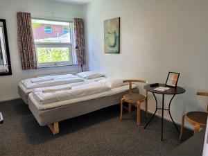 Voodi või voodid majutusasutuse Aarhus Hostel og Hotel toas