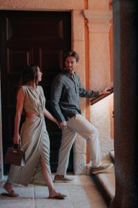 a man and a woman standing in front of a door at Casa da Companhia, Vignette Collection by IHG in Porto +37 photos