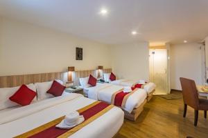 Un pat sau paturi într-o cameră la Hotel Goodwill Patan Durbar Square, Kathmandu