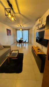 a living room with a couch and a table at Guesthouse Park in Cordoba