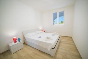 Posteľ alebo postele v izbe v ubytovaní La Primula Apartment 3 Sea View - Happy Rentals