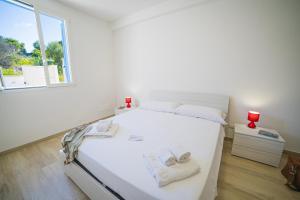 Posteľ alebo postele v izbe v ubytovaní La Primula Apartment 3 Sea View - Happy Rentals