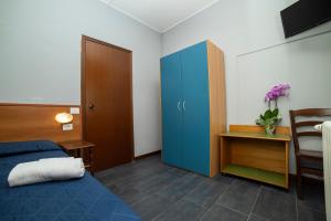 Postel nebo postele na pokoji v ubytování Hotel Victoria