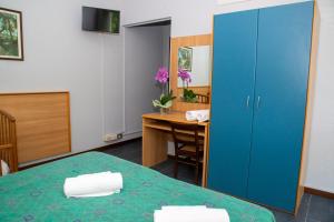 Postel nebo postele na pokoji v ubytování Hotel Victoria