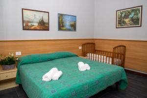 Postel nebo postele na pokoji v ubytování Hotel Victoria