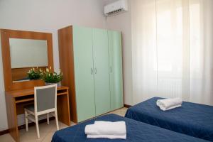 Postel nebo postele na pokoji v ubytování Hotel Victoria