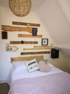 a bedroom with a bed with a sign on it at ESTRELIAS - maison de vacances - Cauterets centre in Cauterets +20 photos
