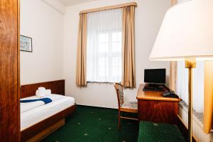 TV a/nebo společenská místnost v ubytování Hotel Brander Hof