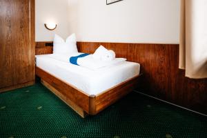 Postel nebo postele na pokoji v ubytování Hotel Brander Hof