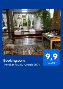 a picture of a room with a table and chairs at Casa Dona Hilda Blumenau in Blumenau