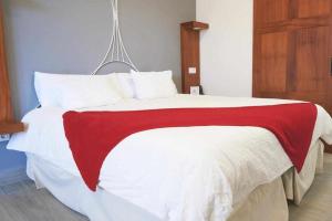 A bed or beds in a room at Delmás Hotel Emblemático