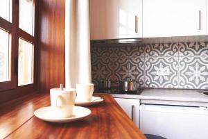 A kitchen or kitchenette at Delmás Hotel Emblemático