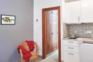 A kitchen or kitchenette at Delmás Hotel Emblemático