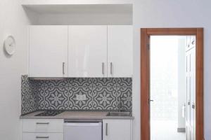 A kitchen or kitchenette at Delmás Hotel Emblemático