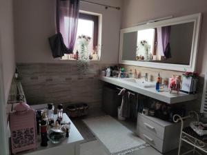 a bathroom with a sink and a mirror at Elegant House in a Small Village in Tur