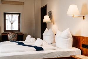 Postel nebo postele na pokoji v ubytování Hotel Brander Hof