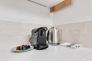 a toaster sitting on a counter in a kitchen at Charming Apartment Gacé I 4P in Gacé