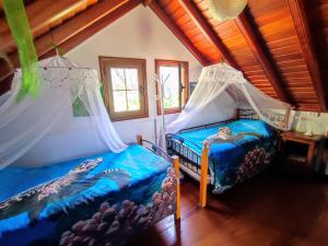 Postel nebo postele na pokoji v ubytování Rivendell Eco lodge