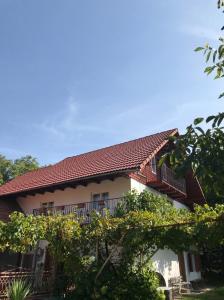 a building with a balcony on top of it at Casa Matei in Poarta