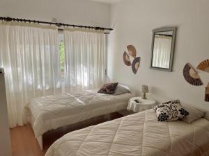 Ένα ή περισσότερα κρεβάτια σε δωμάτιο στο 3 Room Apartment S Jõao Caparica