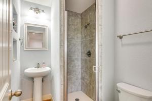 a bathroom with a shower and a sink and a toilet at Walk to Beach Galveston Home with Golf Cart! in Galveston +18 photos