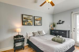 a bedroom with a bed and a ceiling fan at Walk to Beach Galveston Home with Golf Cart! in Galveston