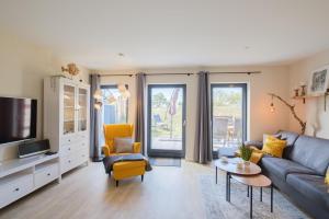 Televisyen dan/atau pusat hiburan di Ferienwohnung "Strandgut No 1 - Aurora Vista" +19 gambar