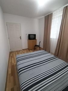 Postel nebo postele na pokoji v ubytování Todor Apartment