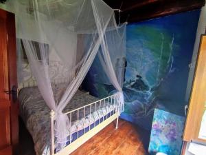 Postel nebo postele na pokoji v ubytování Rivendell Eco lodge