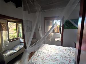 Postel nebo postele na pokoji v ubytování Rivendell Eco lodge